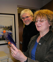 David Bzik (left) and Barbara Fox examine flasks for infection